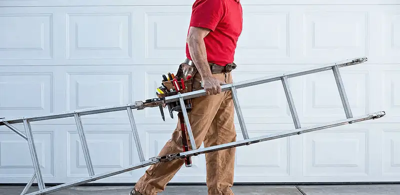 Garage door repair technician arriving with tools and ladder in Shreveport, LA