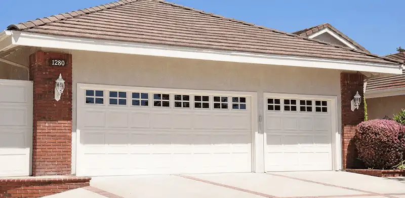 Residential garage door repair service for a double garage door in Shreveport, LA