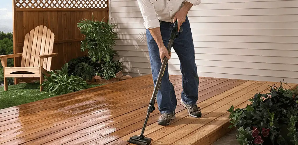 Deck staining service applying stain to a backyard wood deck in Shreveport, LA